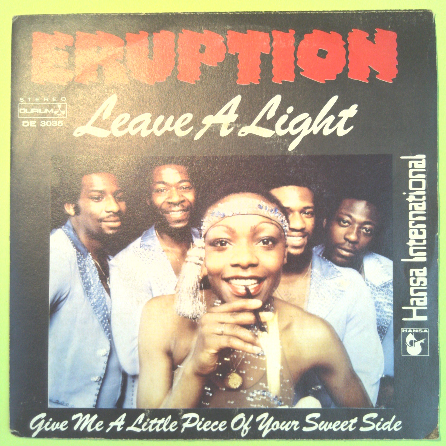 LEAVE A LIGHT/GIVE ME A LITTLE PIECE OF YOUR SWEET SIDE ERUPTION 45 GIRI DE 3035